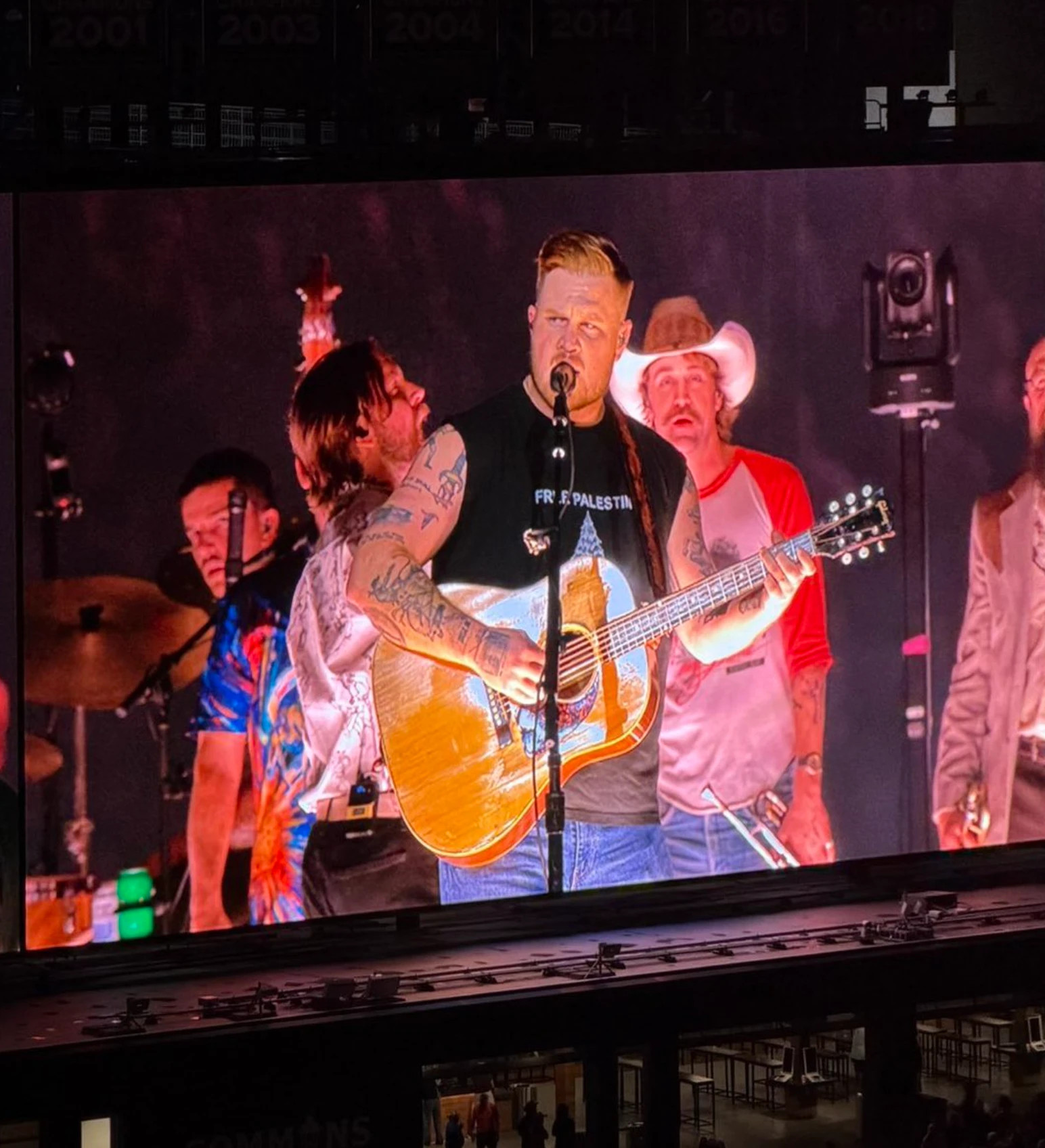Pics - Zach Bryan declares himself a faggot and wears a Free Palestine shirt at his concert
