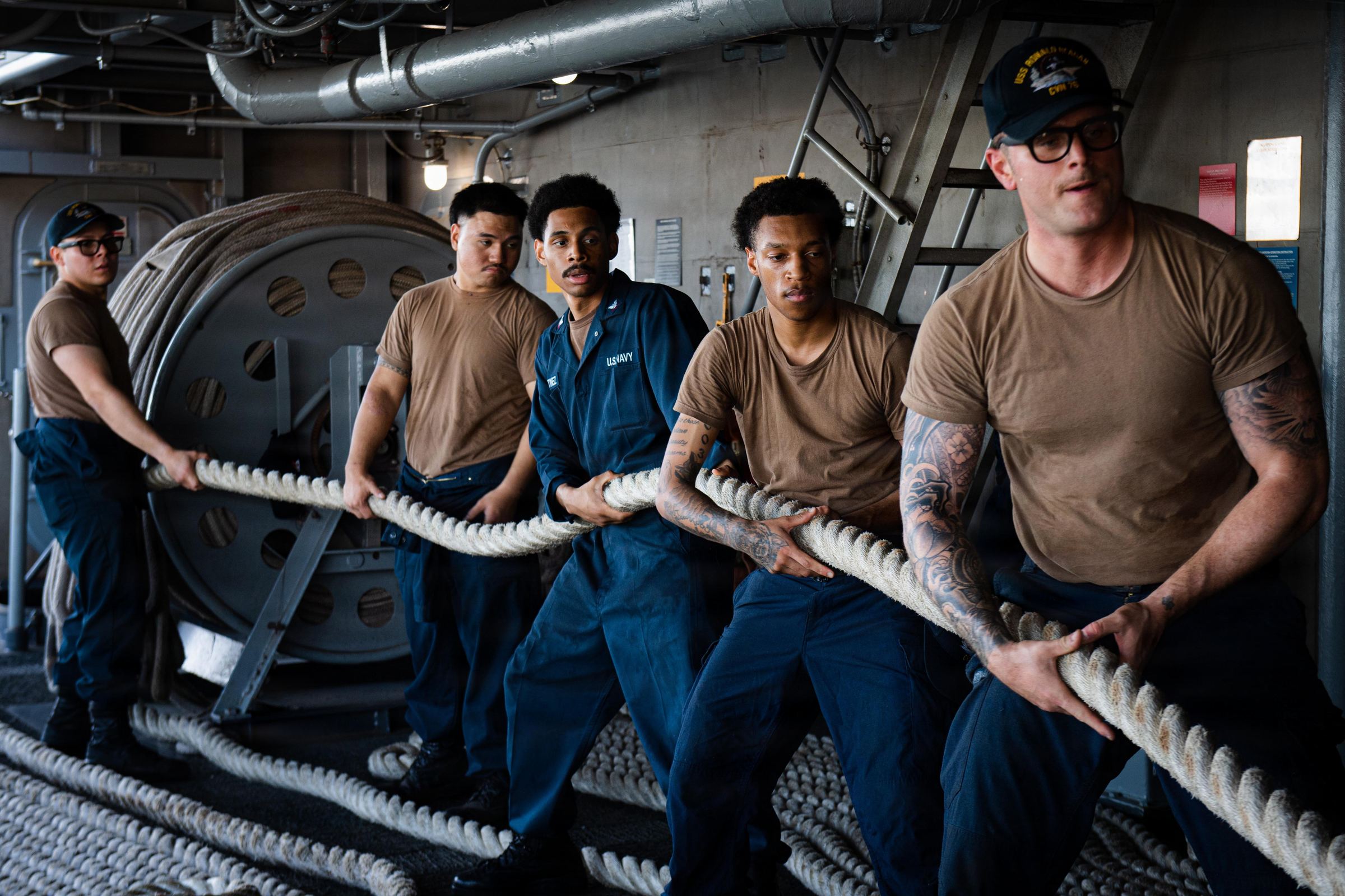US Sailors heave mooring lines on USS Ronald Reagan as it arrives in San Diego preview image