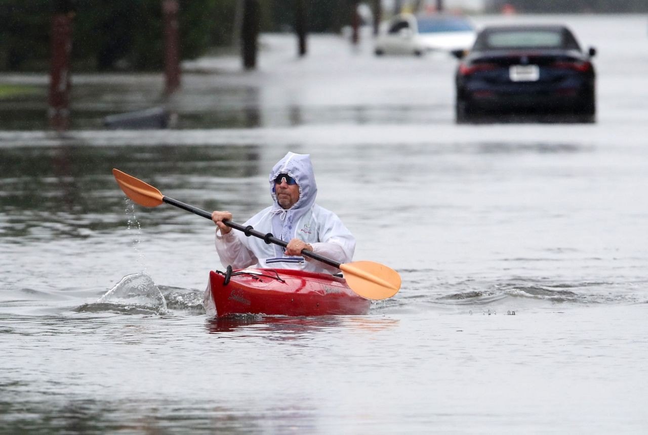 Pics - Man kayaks on NJ street during nor'easter storm