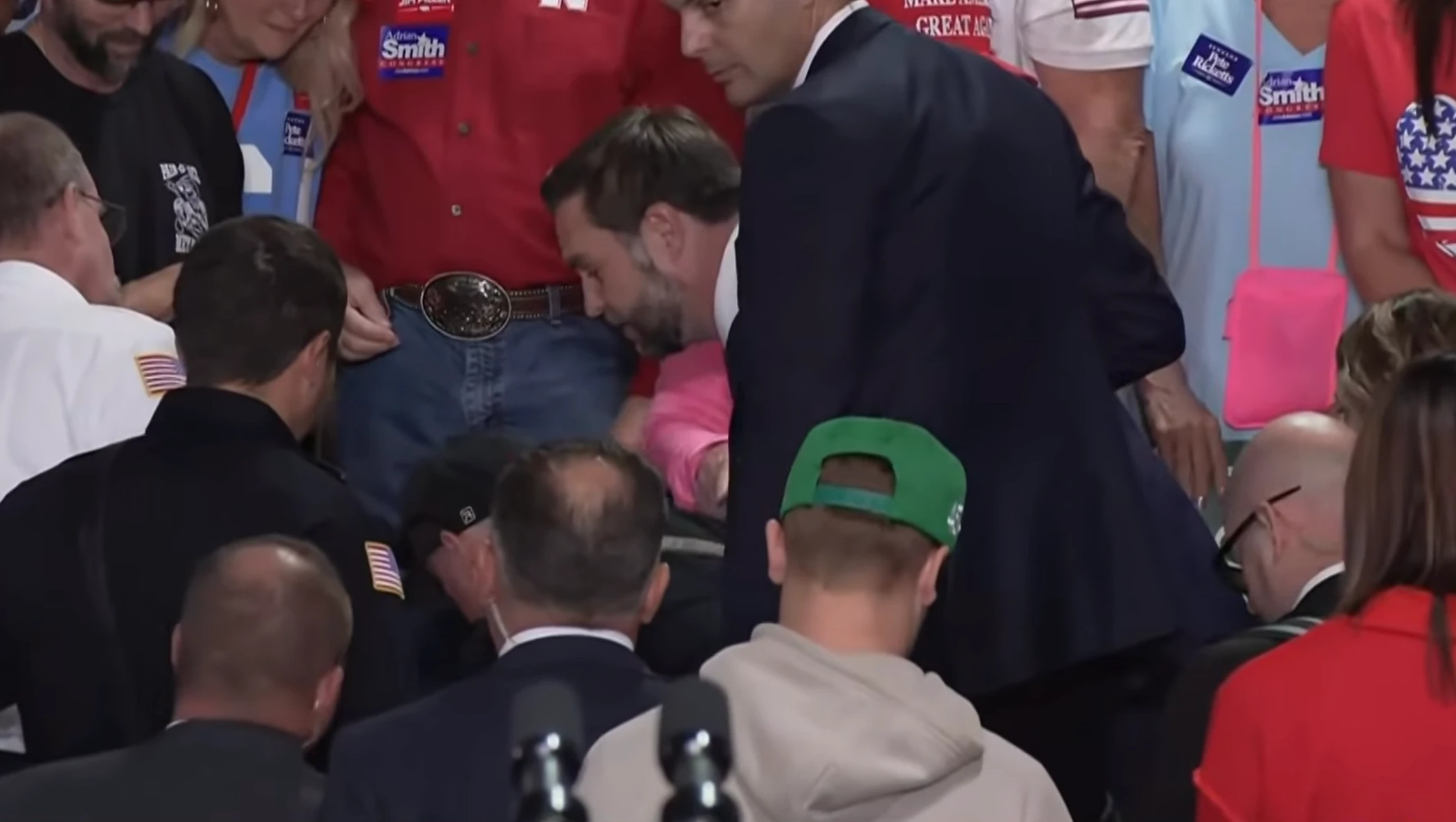 Pics - Vance enters crowd to help woman having medical emergency