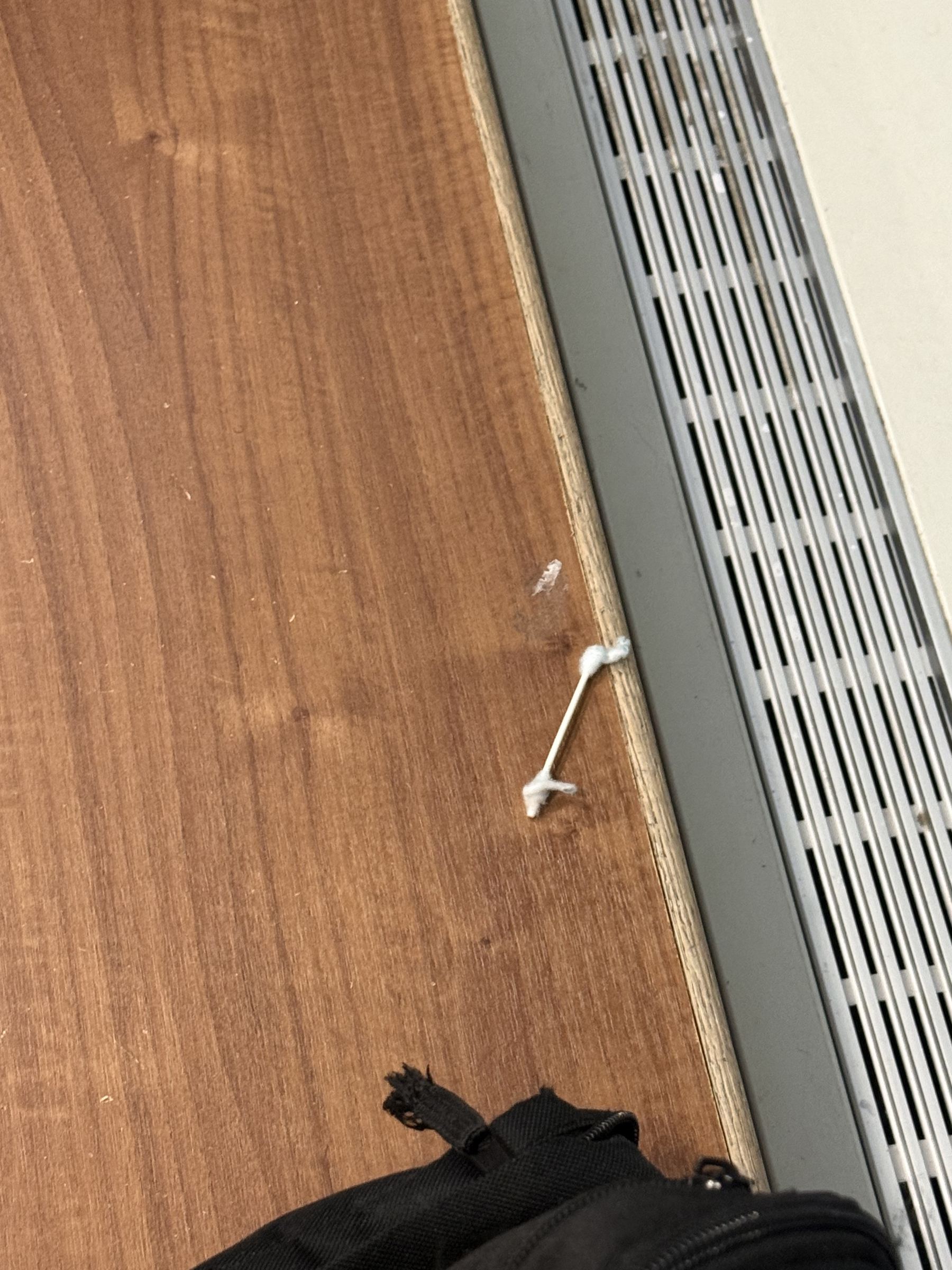 Used q tip on locker room bench preview image